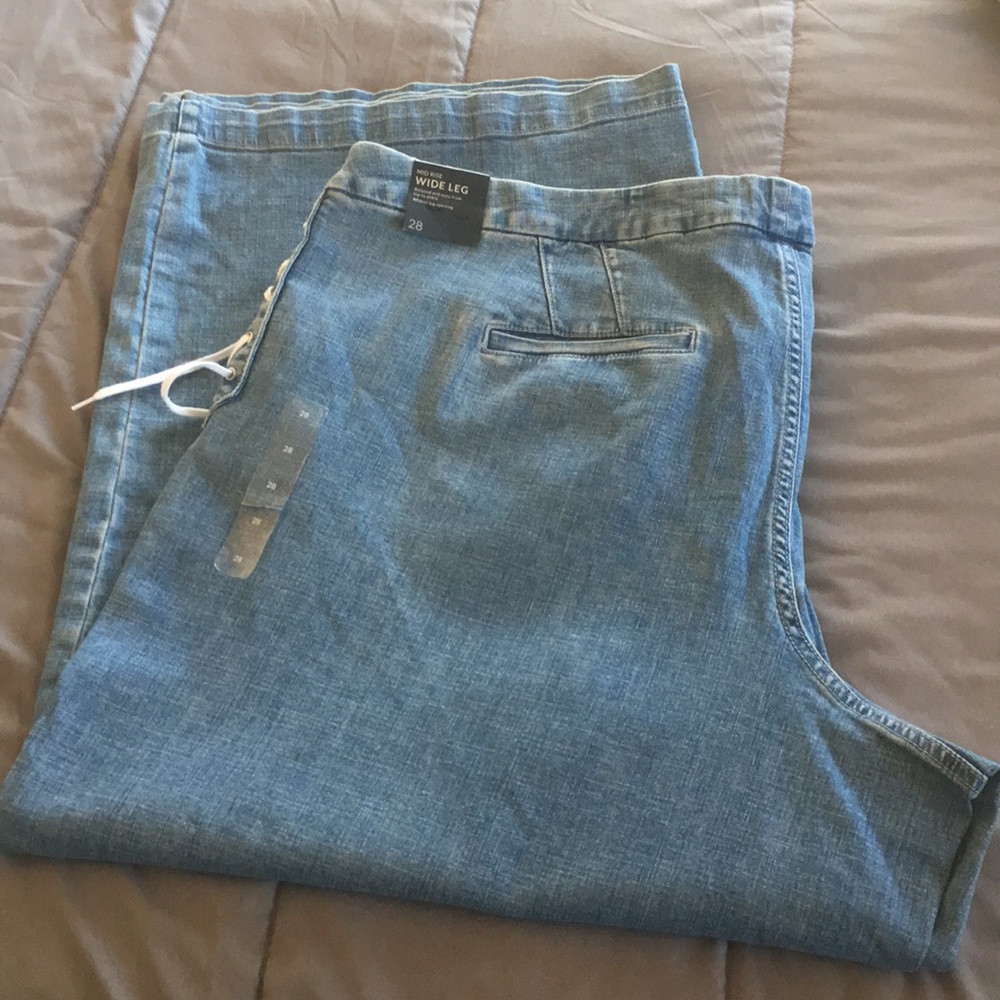Lane Bryant lace-up mid-rise wide leg jeans.